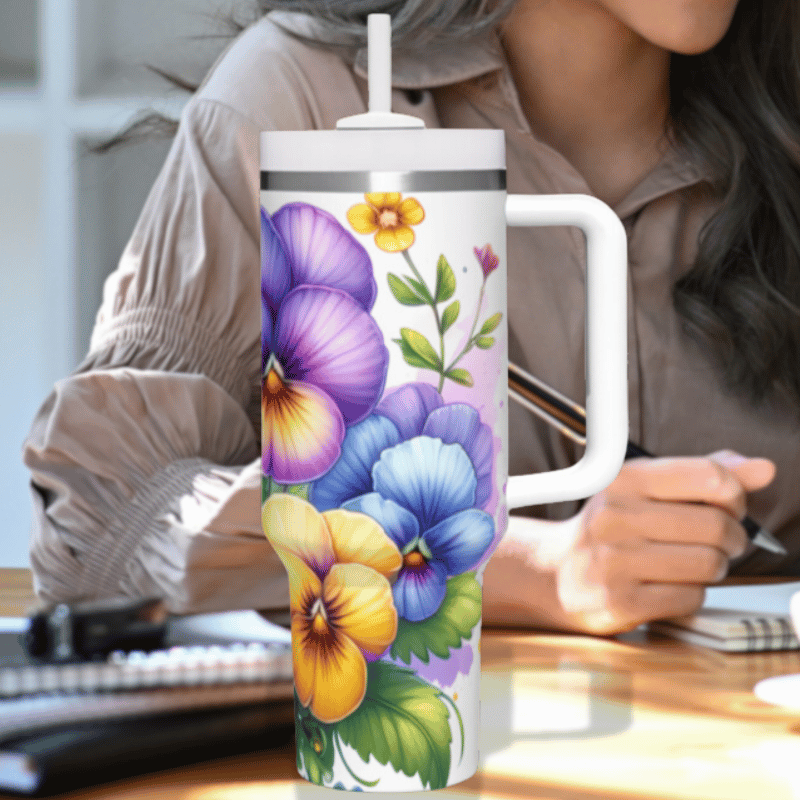 a woman sitting at a desk with a coffee mug