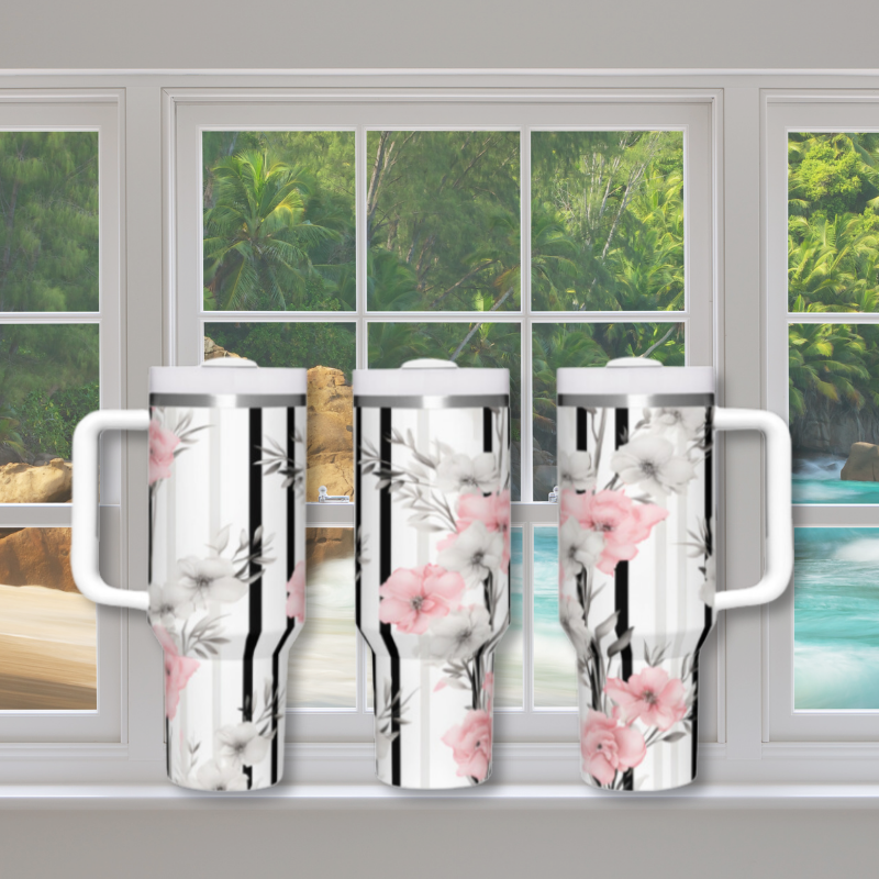 a couple of cups sitting on top of a window sill