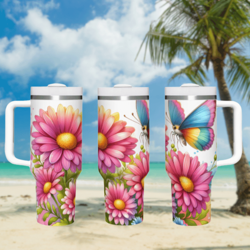 three travel mugs on a sandy beach with a palm tree in the background