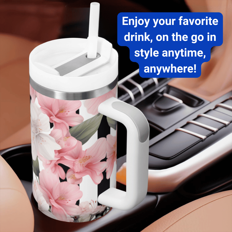 a cup with a handle and a flower pattern on it