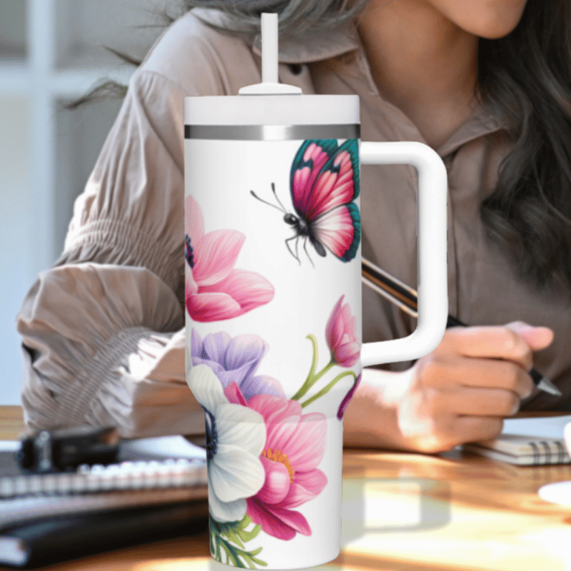 a woman sitting at a desk with a coffee mug