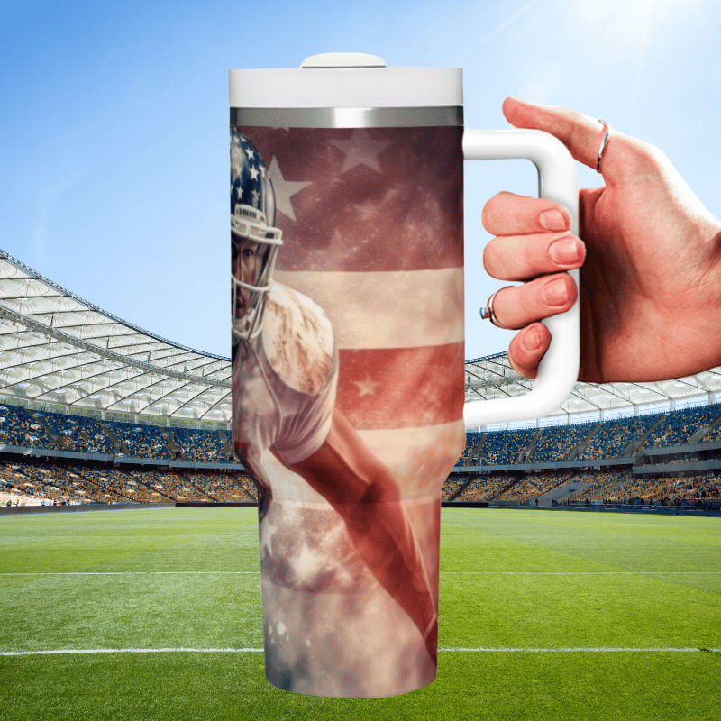 a hand holding a coffee mug with a picture of a football player on it