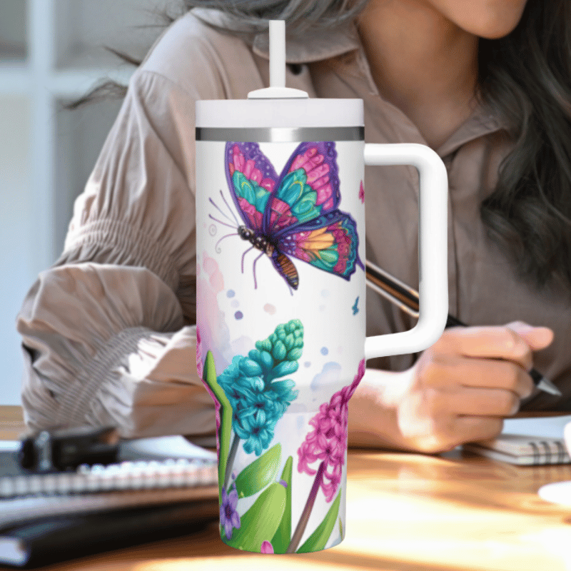 a woman sitting at a desk with a coffee mug