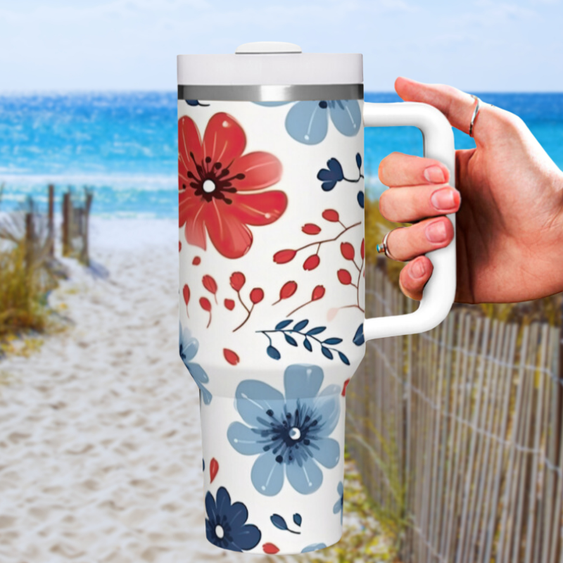 a person holding a travel mug in front of a beach