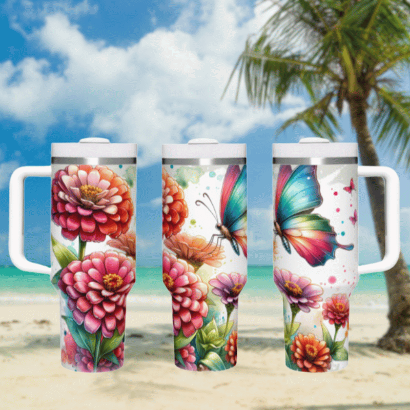 three travel mugs on a beach with a palm tree in the background