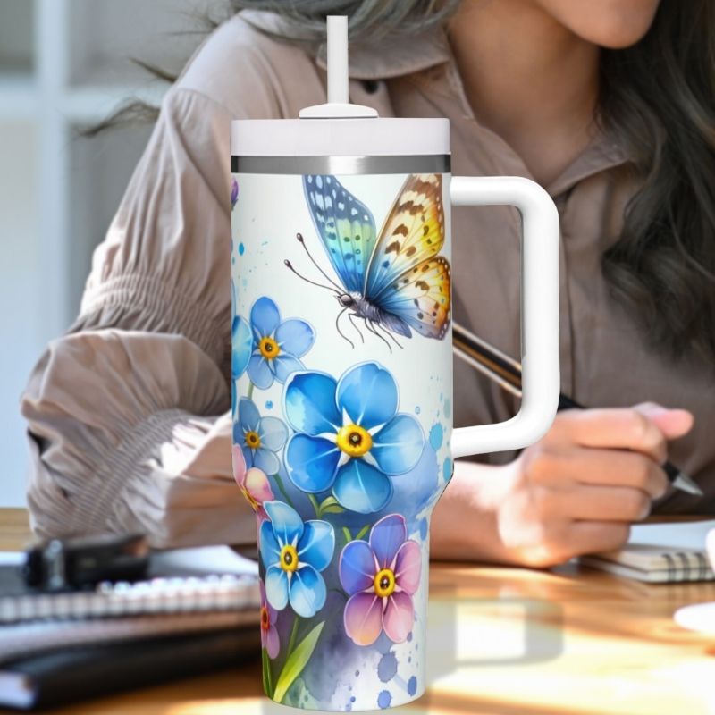 a woman sitting at a desk with a coffee cup