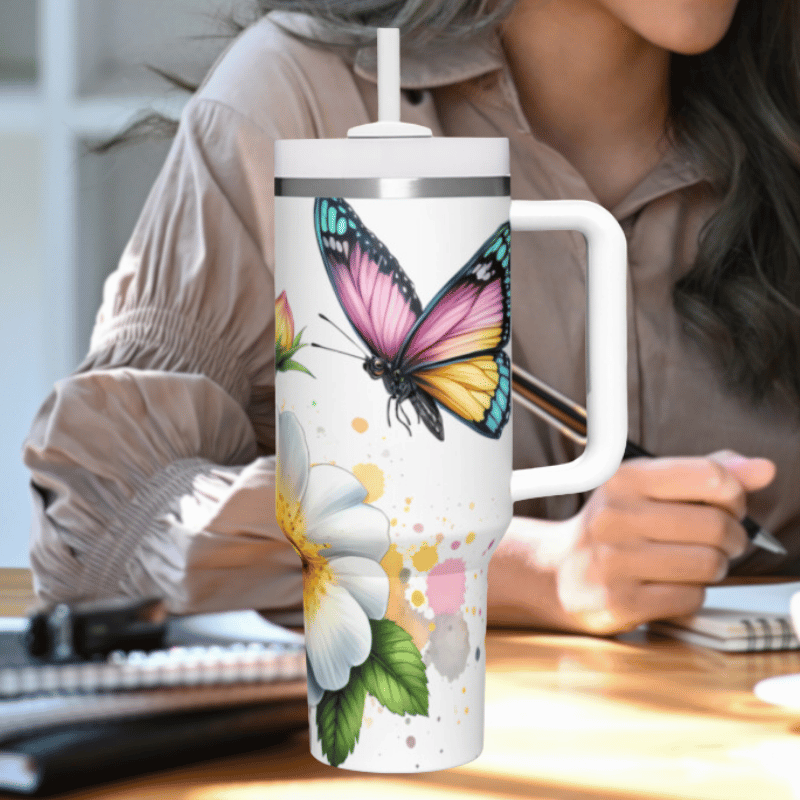 a woman sitting at a desk with a coffee cup