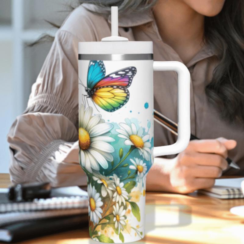 a woman sitting at a desk with a coffee mug