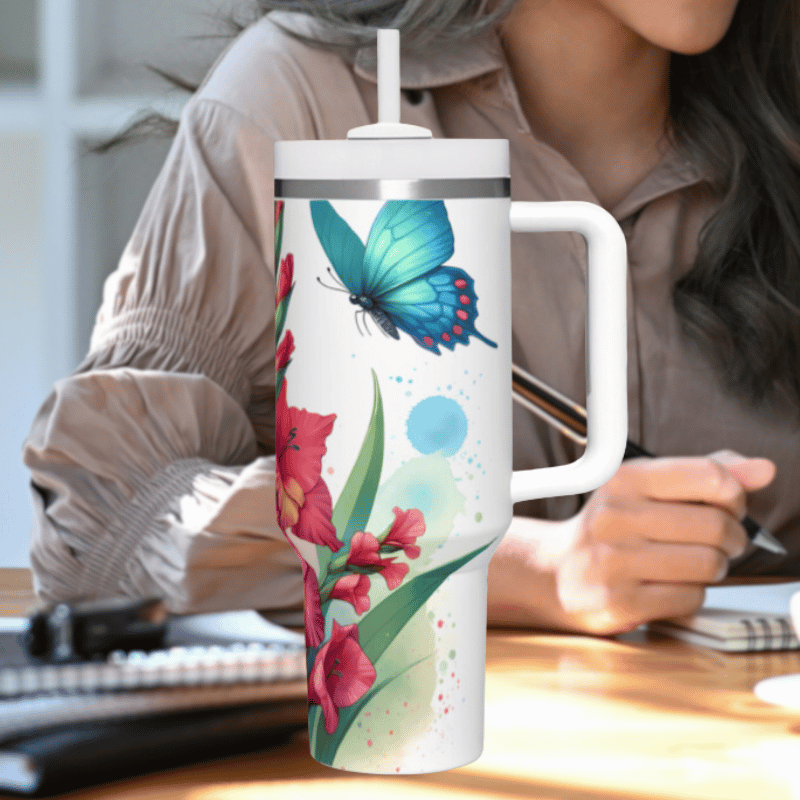 a woman sitting at a desk holding a coffee mug