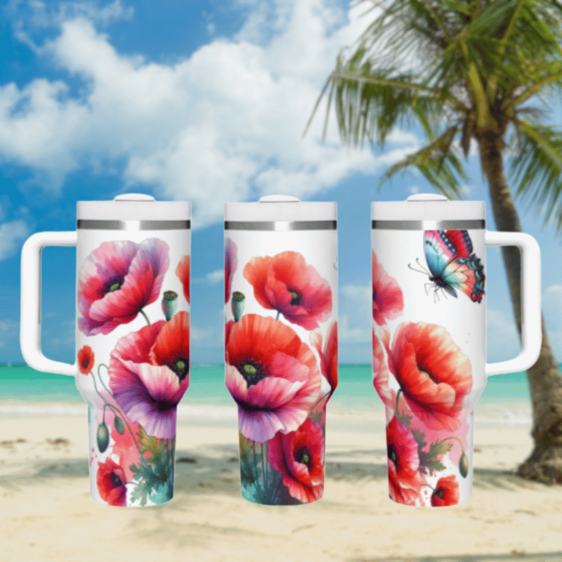 three travel mugs on a beach with a palm tree in the background