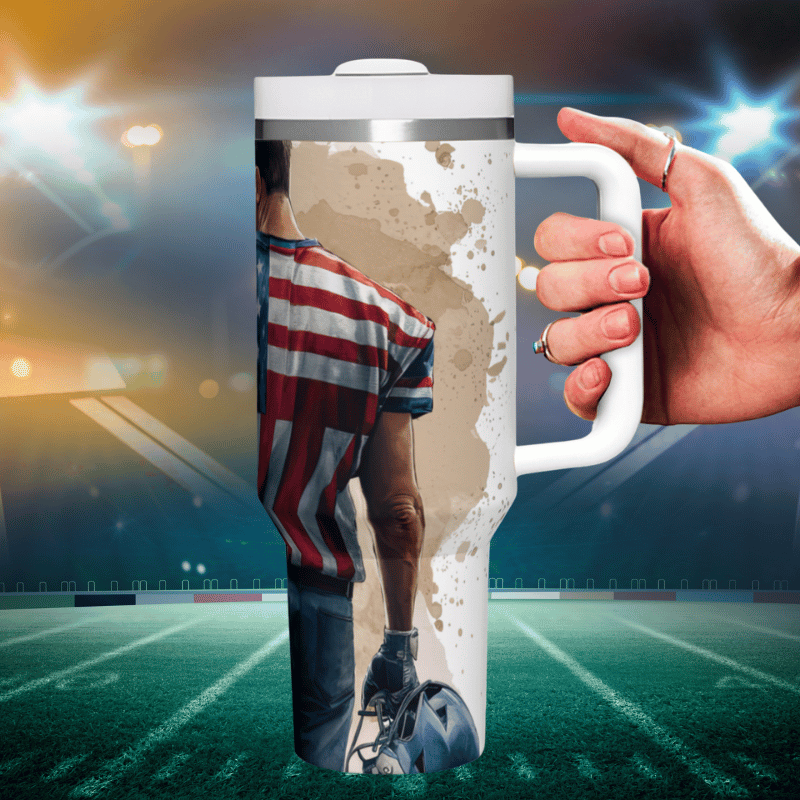 a hand holding a coffee mug with a picture of a football player on it