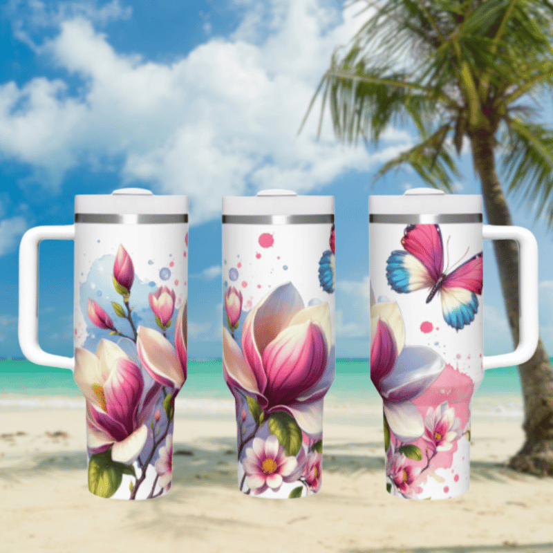 three travel mugs on a beach with a palm tree in the background