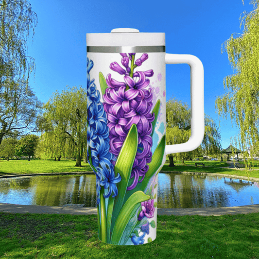 a large white coffee mug with purple flowers painted on it