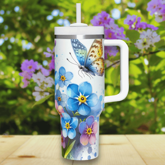 a blue and white butterfly on a white travel mug