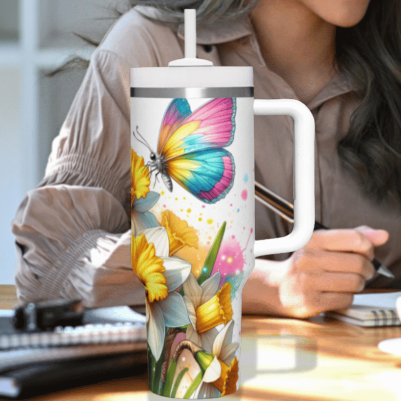 a woman sitting at a desk with a coffee mug