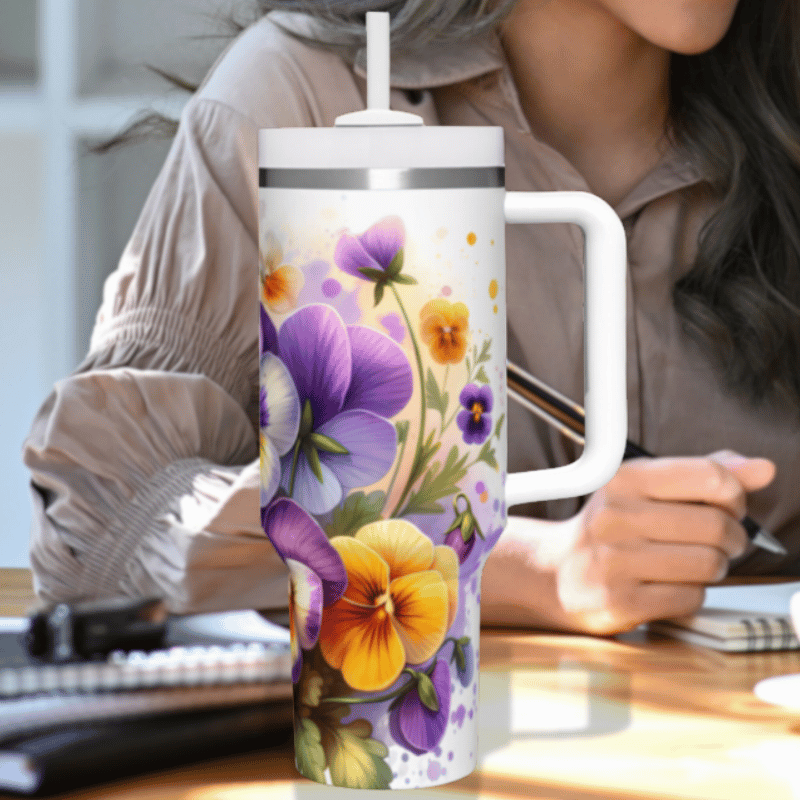 a woman sitting at a desk with a coffee mug