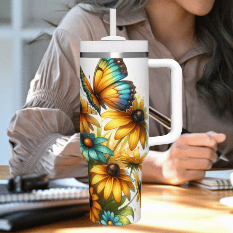 a woman sitting at a desk with a coffee mug