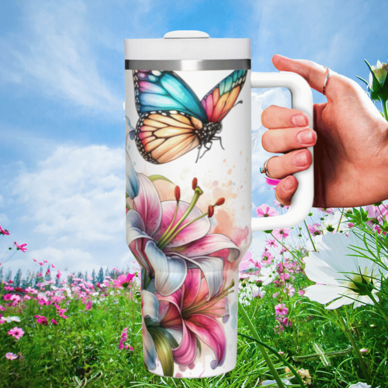 a hand holding a coffee mug with a butterfly on it