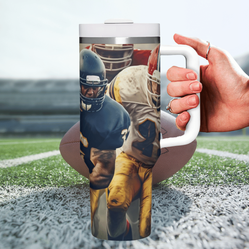 a hand holding a coffee mug with a football player on it