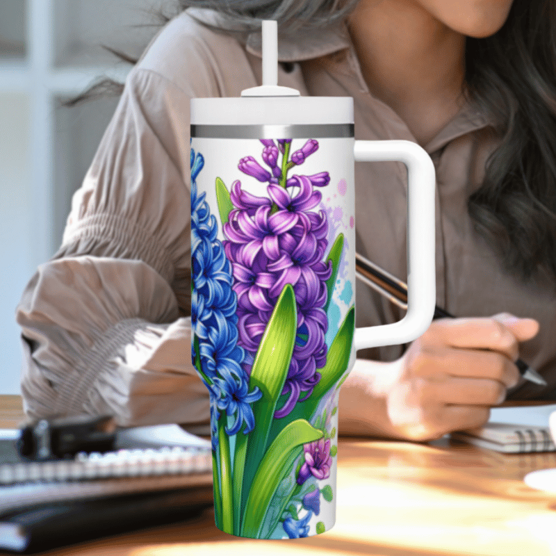 a woman sitting at a desk with a coffee mug