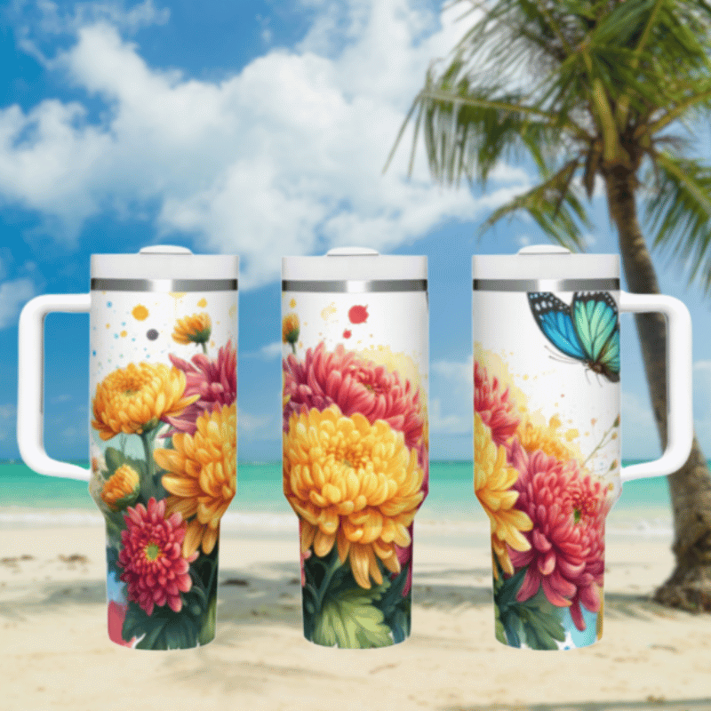 three travel mugs on a beach with a palm tree in the background