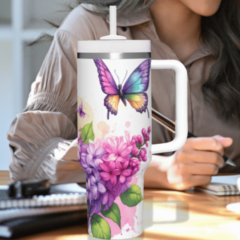 a woman sitting at a desk with a coffee mug