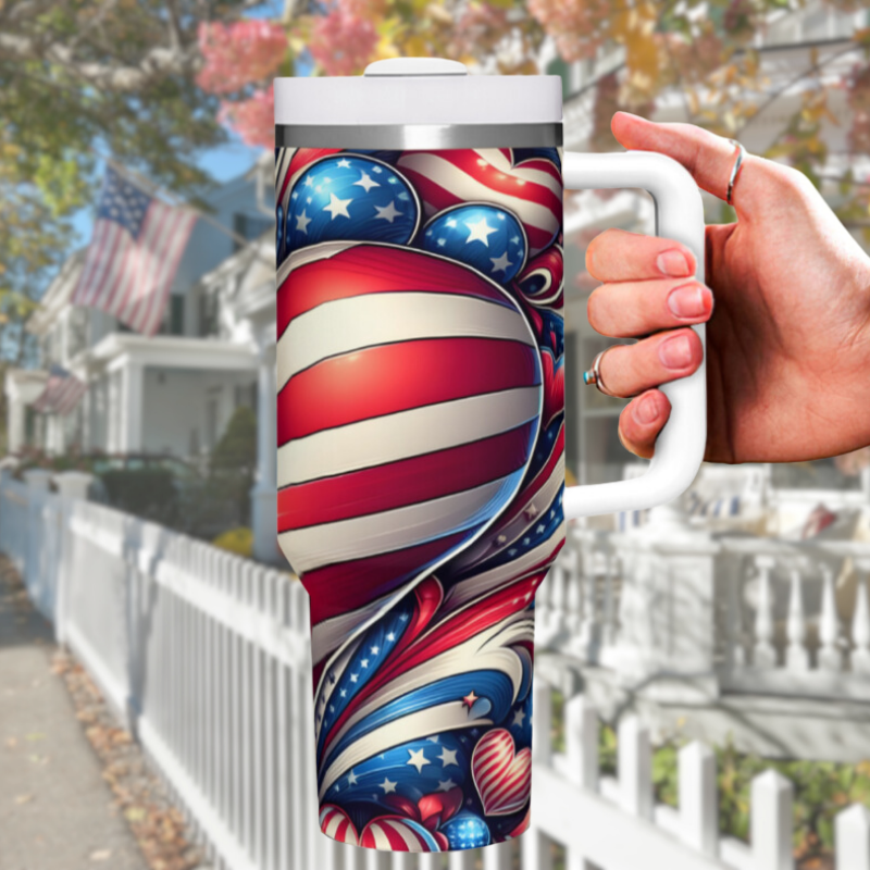 a hand holding a travel mug with a patriotic design