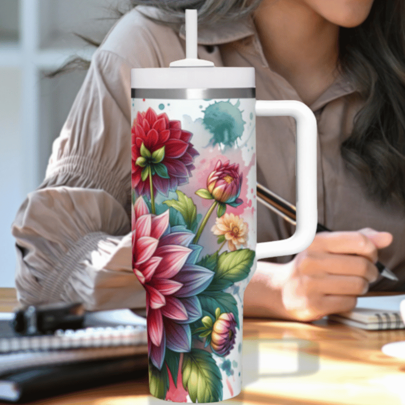 a woman sitting at a desk holding a coffee mug