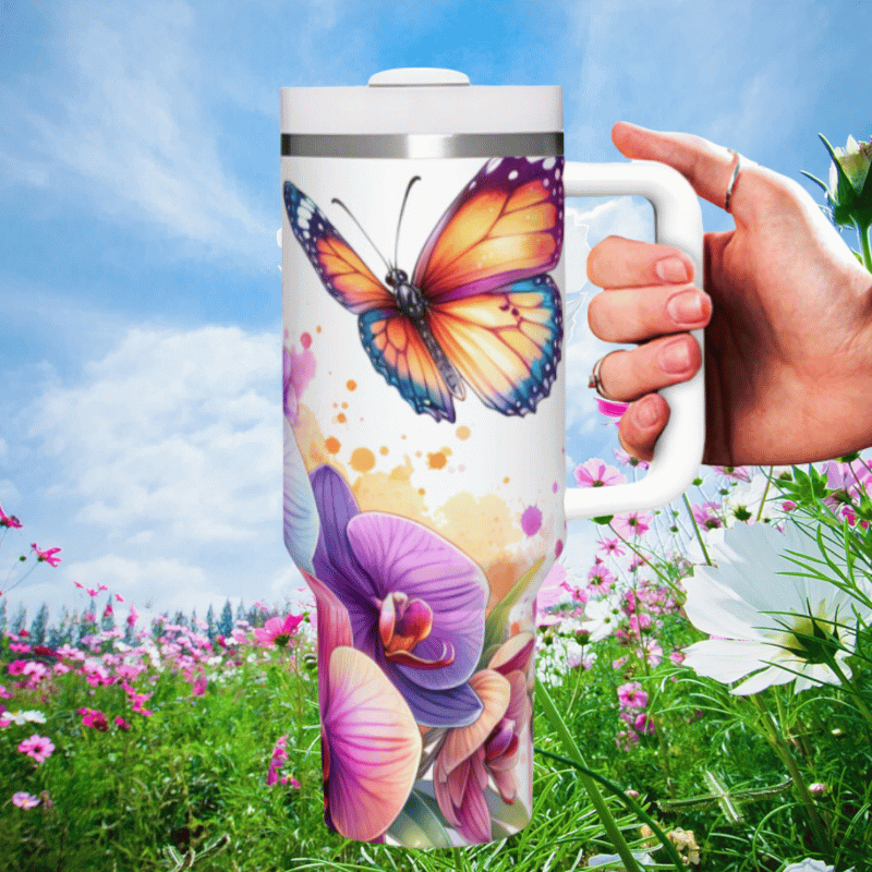 a hand holding a coffee mug in a field of flowers