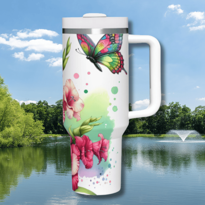 a white travel mug with a colorful butterfly on it