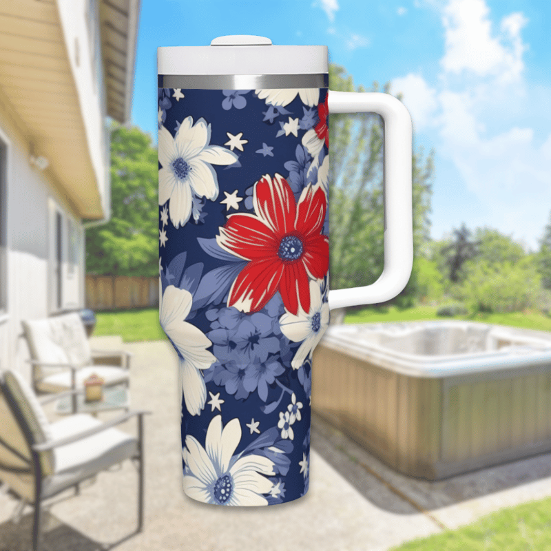 a blue and white flowered mug sitting in front of a house