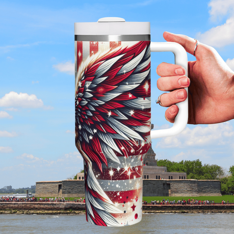 a hand holding a coffee mug with a patriotic design on it