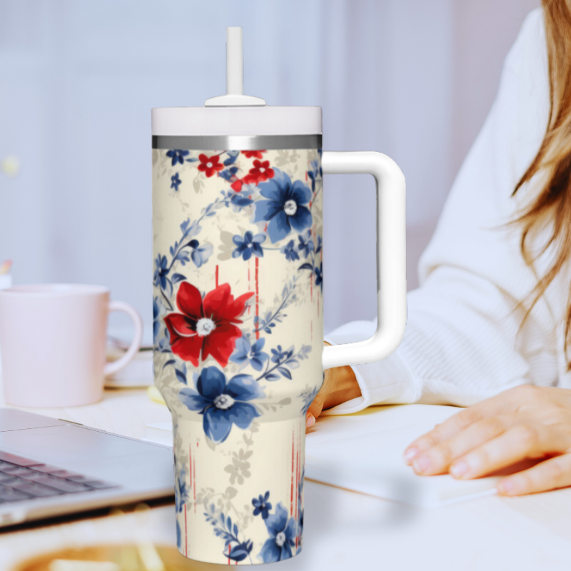 a woman sitting at a desk with a laptop and a mug