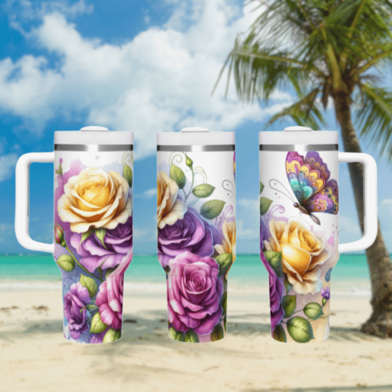 three travel mugs on a beach with a palm tree in the background