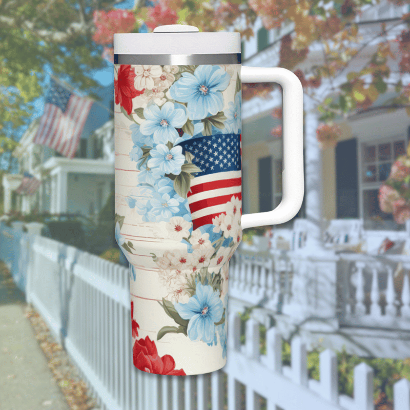 a coffee cup with an american flag and flowers on it