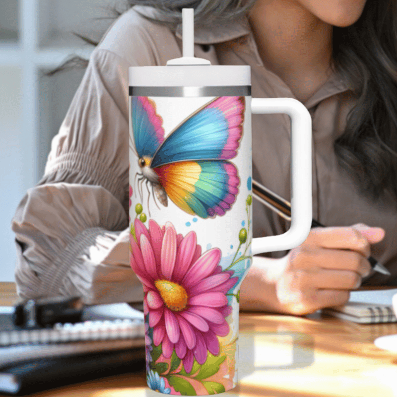 a woman sitting at a desk with a coffee mug