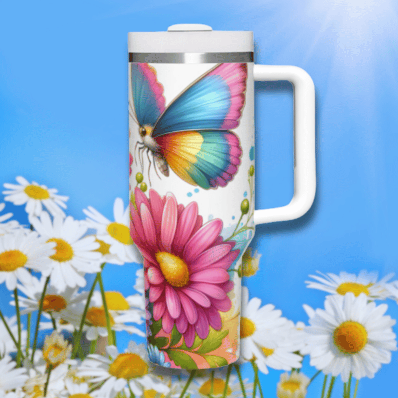 a colorful butterfly painted on a white travel mug