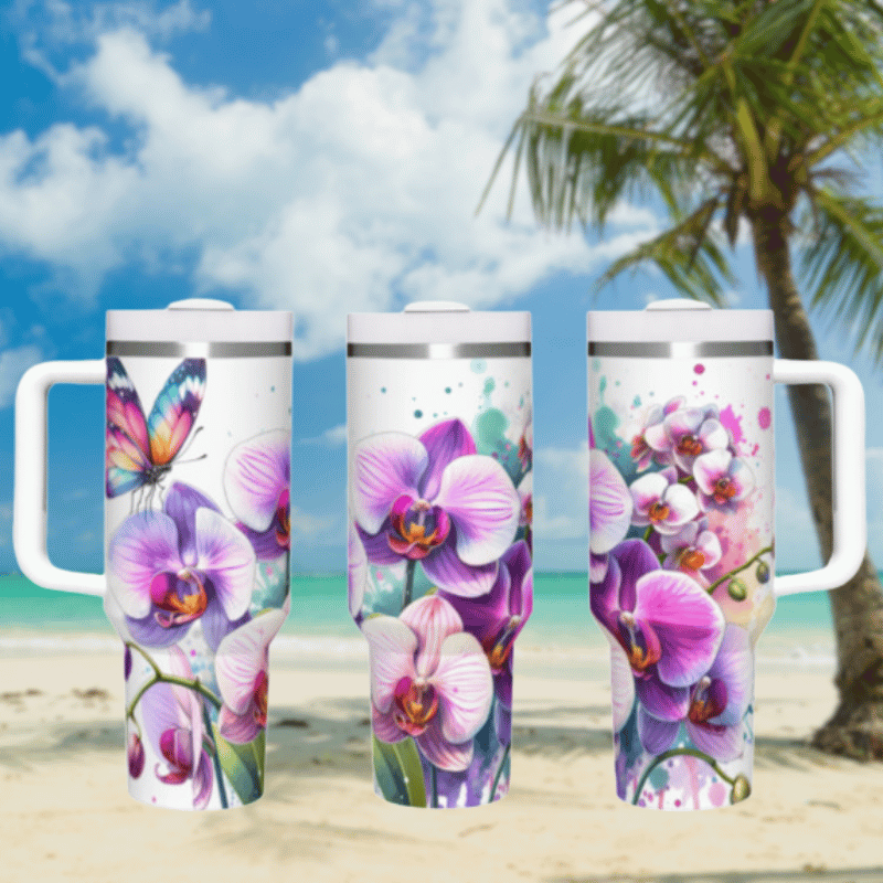 three travel mugs on a beach with a palm tree in the background