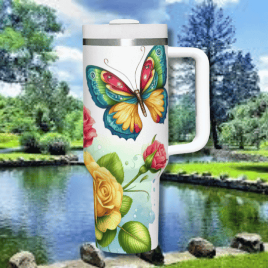 a white travel mug with a colorful butterfly on it