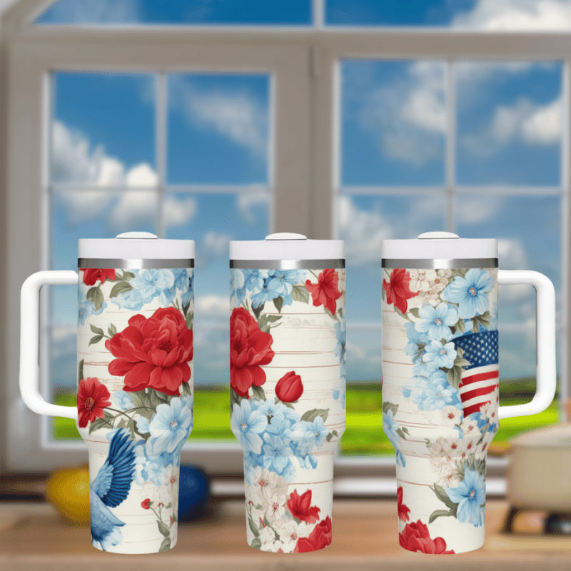 three travel mugs sitting on a table in front of a window