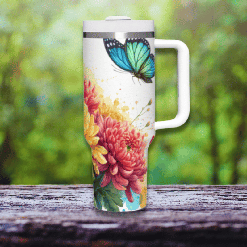 a coffee cup with a butterfly painted on it