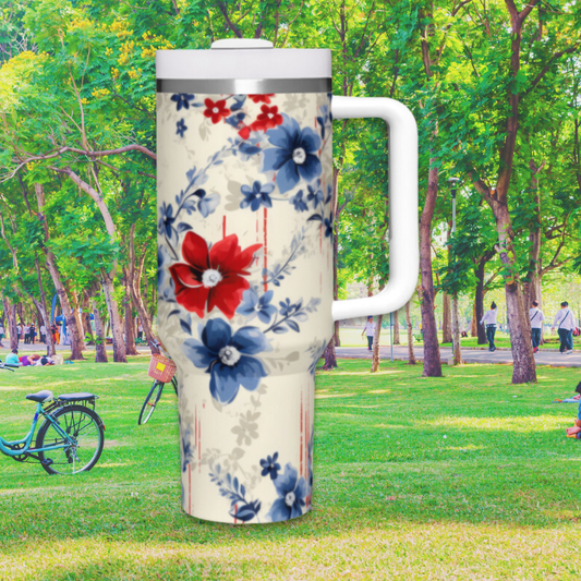 a white and blue floral mug in a park