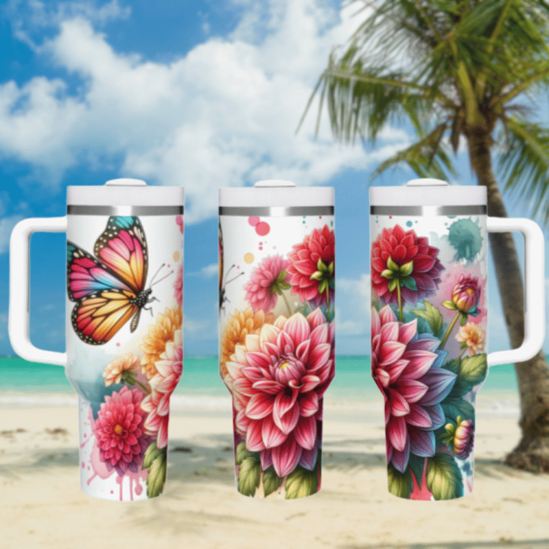 three travel mugs on a beach with a butterfly and flowers painted on them