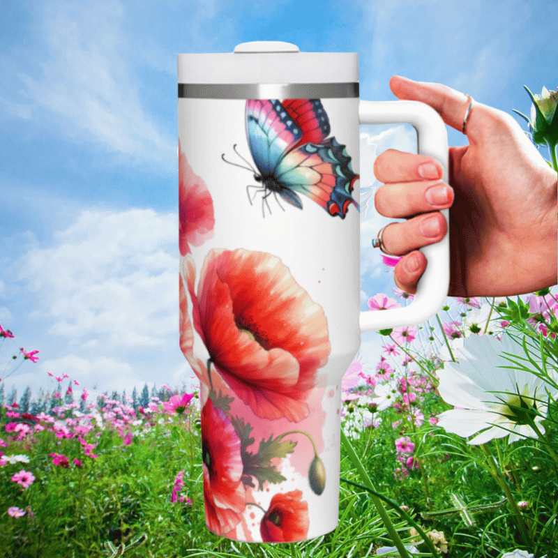 a person holding a coffee mug in a field of flowers