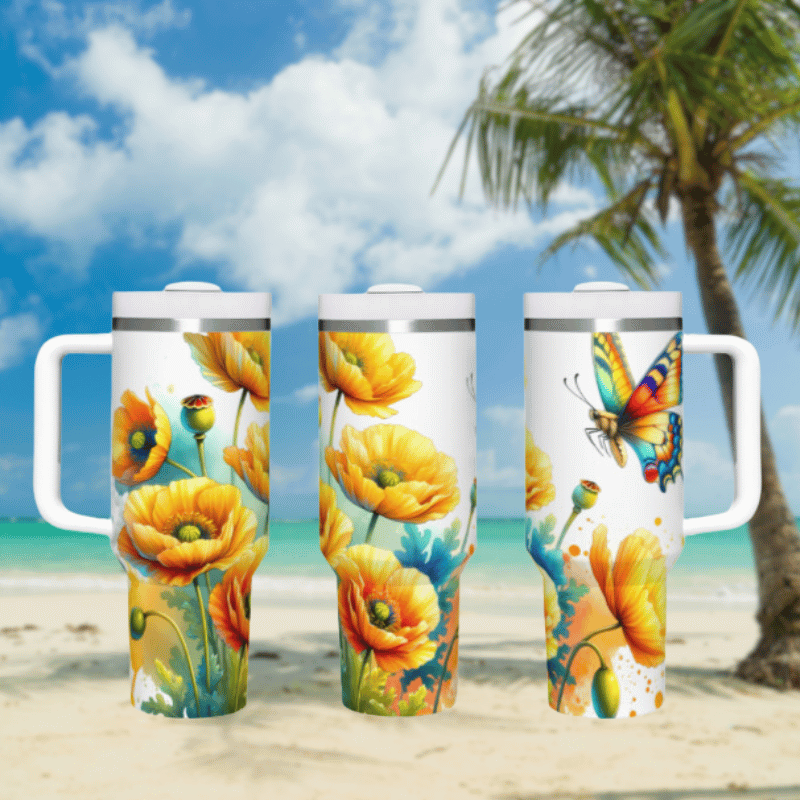 three travel mugs on a beach with a palm tree in the background