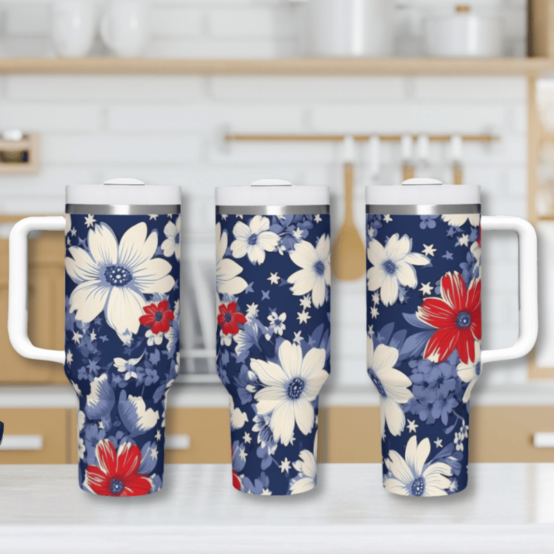 three floral travel mugs sitting on a kitchen counter