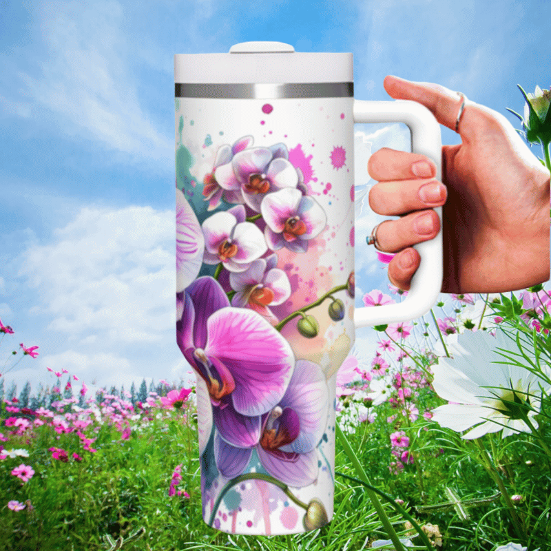 a hand holding a coffee mug in a field of flowers