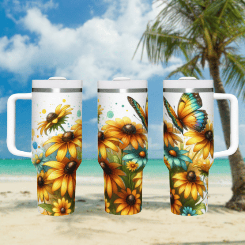 three travel mugs on a sandy beach with a palm tree in the background